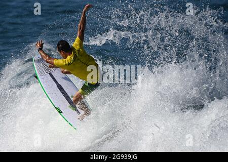 Chiba, Japan. 24th July, 2021. Julian Wilson of Australia rides a wave during a training session at Tsurigasaki beach in Chiba, Japan, July 24, 2021. Credit: Du Yu/Xinhua/Alamy Live News Stock Photo