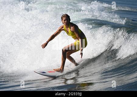 Chiba, Japan. 24th July, 2021. Stephanie Gilmore of Australia rides a wave during a training session at Tsurigasaki beach in Chiba, Japan, July 24, 2021. Credit: Du Yu/Xinhua/Alamy Live News Stock Photo