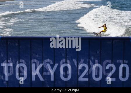 Chiba, Japan. 24th July, 2021. Stephanie Gilmore of Australia rides a wave during a training session at Tsurigasaki beach in Chiba, Japan, July 24, 2021. Credit: Du Yu/Xinhua/Alamy Live News Stock Photo