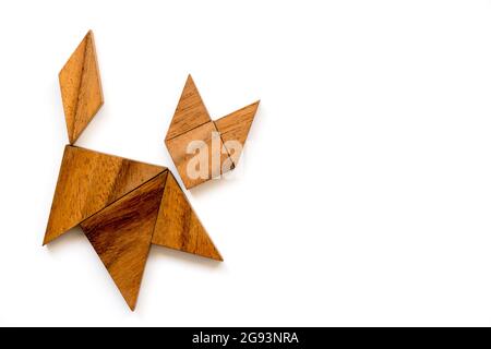 Wood tangram puzzle in cat shape on white background Stock Photo