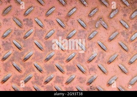 Grunge old red color of diamond shape metal plate textured background Stock Photo