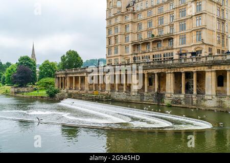 BATH, UK - JUNE 27, 2021: View of weir and the River Avon in Bath, the largest city in the county of Somerset, Stock Photo