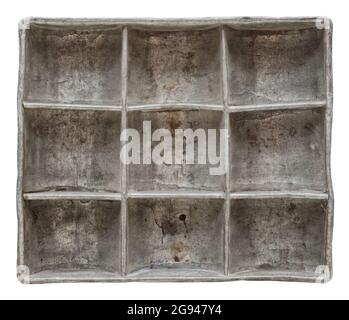 Isolated objects: very old aluminium container, divided into nine compartments, on white background Stock Photo