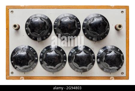 Isolated objects: very old control panel with five adjustment knobs, on white background Stock Photo