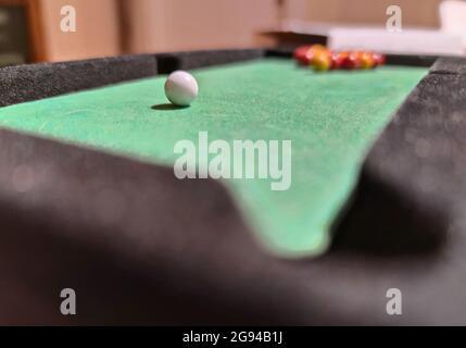 billiards, miniature playing field with balls on the playing field in green table Stock Photo