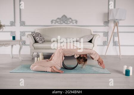 healthy woman starting her morning with yoga and relaxation Stock Photo