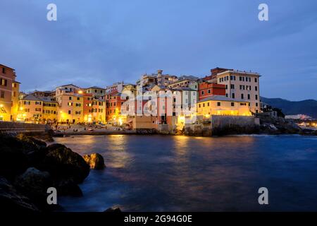 a long exposure photo of Boccadasse beach with the colorful houses and the soft waves behind. Genova, Ligurie, Italy Stock Photo