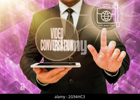 Inspiration showing sign Video Conversation. Concept meaning Communicating visually with another person via computer Man In Office Uniform Standing Stock Photo