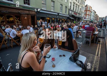 Diverse group of young people celebrating  freedom day' ending over a year of COVID-19 lockdown restrictions in Soho , London ,England Stock Photo