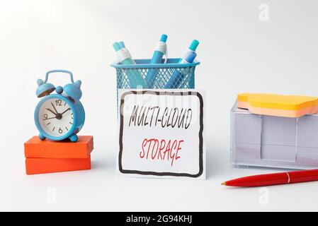 Sign displaying Multi Cloud Storage. Word Written on use of multiple cloud computing and storage services Tidy Workspace Setup Writing Desk Tools And Stock Photo