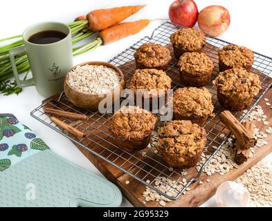 Freshly baked carrot apple oatmeal muffins. Stock Photo