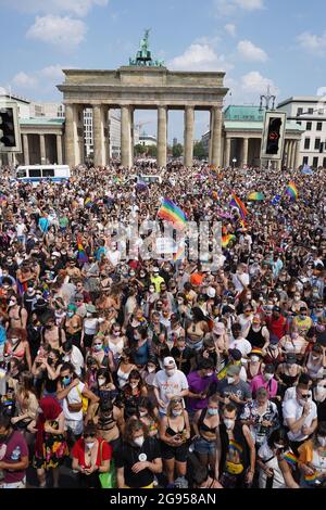 Berlin, Germany. 24th July, 2021. Thousands of people take part in the Christopher Street Day (CSD) parade in front of the Brandenburg Gate. The official motto of the CSD is 'Save our Community - save our Pride', an allusion to the fact that many queer institutions fear for their existence because of the Corona crisis. The CSD is meant to remind people of the rights of lesbians, gays, bisexuals and intersexuals. Credit: Jörg Carstensen/dpa/Alamy Live News Stock Photo