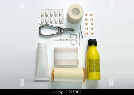 Top view of objects for a first aid kit with medical equipment and medications for emergency. Stock Photo