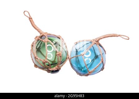 Glass fishing net round buoys. Couple glass spheres with ropes