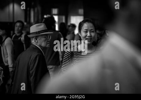 YONGSAN, KOREA, SOUTH - Jun 24, 2015: A grayscale shot of Korean crowd in Yongsan station in South Korea Stock Photo