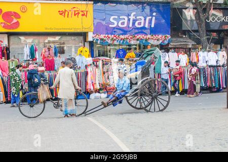 hand drawn rickshaws can be seen in Calcutta from ancient times Stock Photo