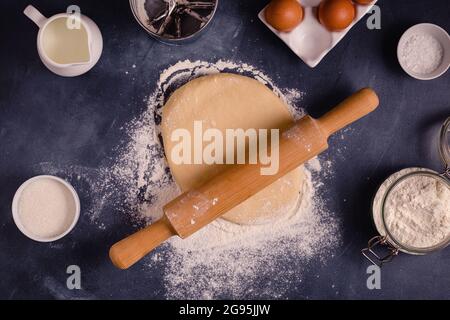 Table with baking products and tools. Culinary, baking concept. Stock Photo