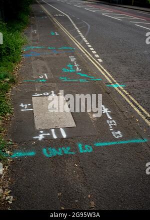 Painted Markings on the pavement for utility work to show what's underneath the surface. Stock Photo
