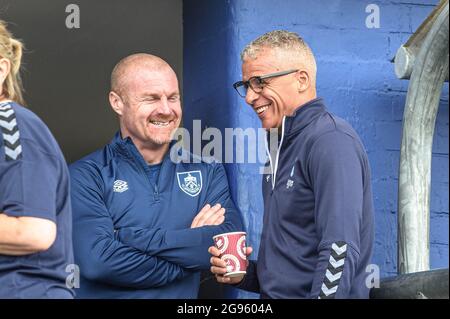 OLDHAM, UK. JUKY 24TH Burnley Manager Sean Dyche (left) chats with Oldham manager Keith Curle, whilst their teams warm up during the Pre-season Friendly match between Oldham Athletic and Burnley at Boundary Park, Oldham on Saturday 24th July 2021. (Credit: Ian Charles | MI News) Credit: MI News & Sport /Alamy Live News Stock Photo