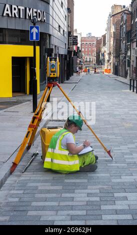 Young female engineer working road construction in Liverpool Stock Photo