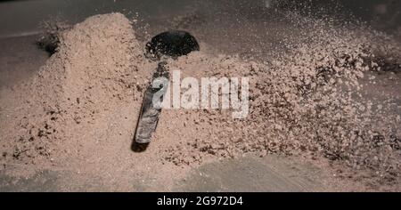 Cocoa splash with a spoon, studio shot Stock Photo