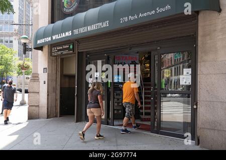 NEW YORK, NY – JULY 24: Shoppers enter a Morton Williams supermarket in Manhattan on July 24, 2021 in New York City.    The Big Apple supermarket chain Morton Williams has decided to severely curb its sales and marketing of Ben & Jerry ice cream after the popular brand took sides in a long-running Middle East controversy.  Ben & Jerry's joining the Boycott, Divestment and Sanctions (BDS) anti-Semitic movement targeting Israel announce that it would stop selling ice cream in what it perceives as the occupied territories. Stock Photo