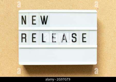Lightbox with word new release on wood background Stock Photo