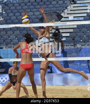 Tokyo, Japan. 24th July, 2021. USA's Alix Klineman and team mate April Ross defend against China's Xinxin Wang during beach volleyball competition at the Tokyo 2020 Olympics, Sunday, July 25, 2021, in Tokyo, Japan. Seating remains empty as spectators are banned from attendance. Photo by Mike Theiler/UPI Credit: UPI/Alamy Live News Stock Photo