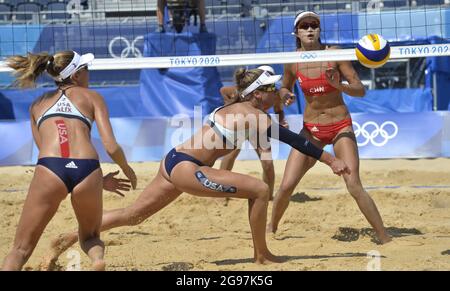 Tokyo, Japan. 24th July, 2021. USA's April Ross (C) and team mate Alix Klineman in action during beach volleyball competition against China's Chen Xue and Xinxin Wang at the Tokyo 2020 Olympics, Sunday, July 25, 2021, in Tokyo, Japan. Seating remains empty as spectators are banned from attendance. Photo by Mike Theiler/UPI Credit: UPI/Alamy Live News Stock Photo