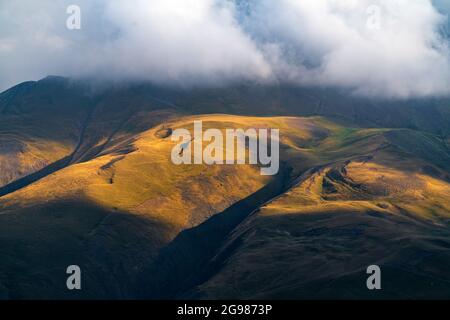 Mountains illuminated by setting sun Stock Photo