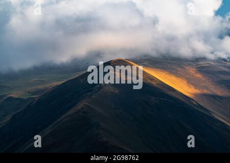 Mountains illuminated by setting sun Stock Photo