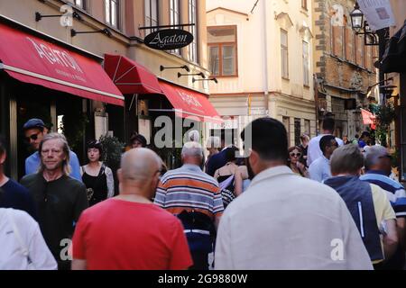 Stockholm, Sweden - July 21, 2021: The crowded Vasterlanggatan street in the Old town district near the restaurant Agaton. Stock Photo