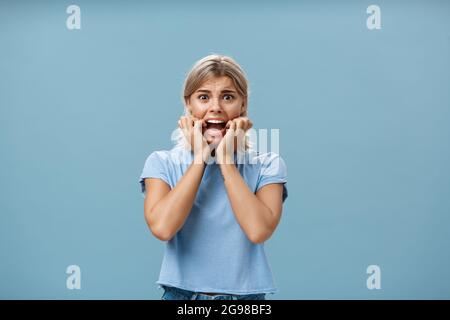 Indoor shot of shocked troubled girlfriend hearing mom returned home ...