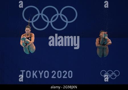 Tokyo, Japan. 25th July, 2021. Jennifer Abel (R) and Melissa Citrini Beaulieu of Canada compete during the women's synchronised 3m springboard final of diving at Tokyo 2020 Olympic Games in Tokyo, Japan, July 25, 2021. Credit: Xu Chang/Xinhua/Alamy Live News Stock Photo