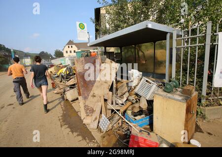 Bad Neuenahr Ahrweiler, Germany. 22nd July, 2021. Bulky waste lies in front of a bus stop. The clean-up work in the flooded area is in full swing. Credit: Bodo Marks/dpa/Alamy Live News Stock Photo