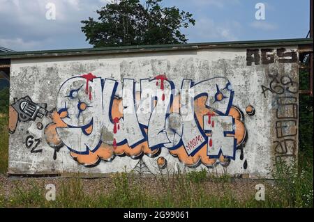 Weathered graffiti on a wall Stock Photo
