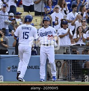 Los Angeles, United States. 25th July, 2021. Los Angeles Dodgers' catcher Austin Barnes (15) celebrates with teammate Billy McKinney (29) after hitting a solo home run off Colorado Rockies starting pitcher Kyle Freeland during the second inning for the game's only run at Dodger Stadium in Los Angeles on Saturday, July 24, 2021. Photo by Jim Ruymen/UPI Credit: UPI/Alamy Live News Stock Photo