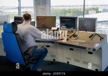 Air traffic controller workplace. Work space of the manager of takeoffs and landings of aircraft at the airport in tower. Monitors, chairs, computers. Air control center office. Unique job. Stock Photo