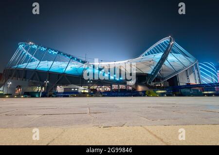 Doha, Qatar – October 1, 2019: Colorful illuminated Khalifa International Stadium in Doha at night, Qatar, Middle East against dark clear sky Stock Photo