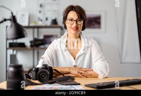Photographer working at office Stock Photo