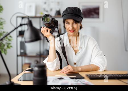 Photographer with camera at office Stock Photo