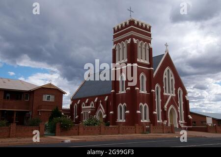 Cobar Australia, St Laurence O'Toole Catholic Church against a stormy sky Stock Photo