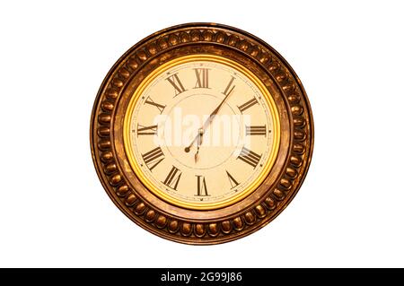 Roman numeral wall clock in a round wooden frame, isolated on white background Stock Photo
