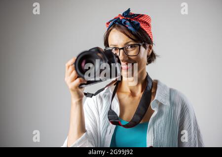 Photographer with camera at studio Stock Photo