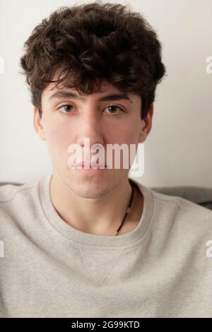 portrait of young caucasian and dark brown hair on camera Stock Photo