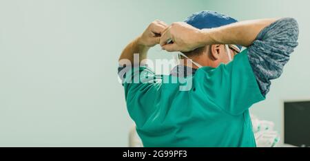 Male doctor operating patient in surgical room at private hospital - Focus on head Stock Photo