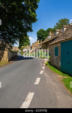 Cotswold cottages along the road through Snowshill village, Gloucesteshire, England Stock Photo