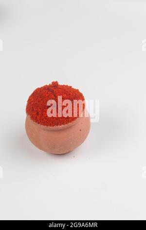 Indian Colourful Spices Also Know as Red Chilli Powder, Mirchi, Mirch Powder Isolated on white Background in pitcher. Stock Photo