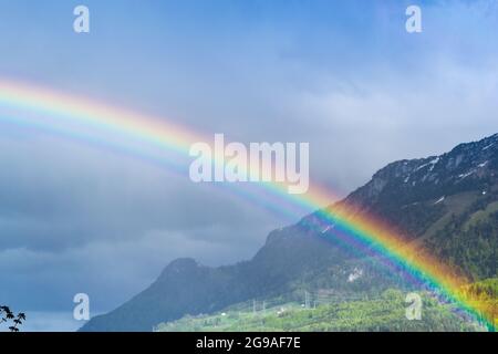 Rainbow in the sky over the mountains. Switzerland Stock Photo