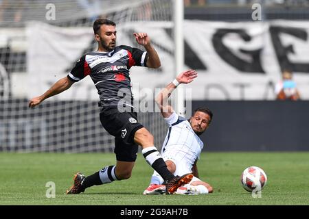 Lugano, Switzerland. 25th July, 2021. Antonio Marchesano (#10 FC Zuerich)  and Sandi Lovric (#24 FC Lugano) during the Super League match between FC  Lugano and FC Zuerich at Cornaredo Stadium in Lugano